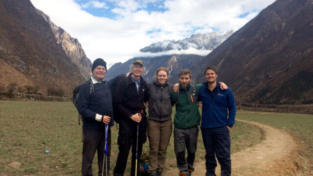 Tetra Tech and Community Action Nepal employees pose together on a hike in Nepal