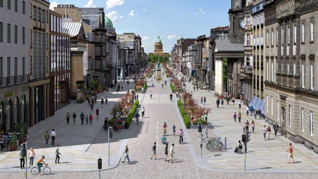 Rendering of the George Street and First New Town Public Realm Improvements Project in Edinburgh A wide pedestrian street lined with historic and modern buildings, bustling with people walking and cycling. In the distance, a prominent dome and clock tower are visible against a blue sky with scattered clouds.
